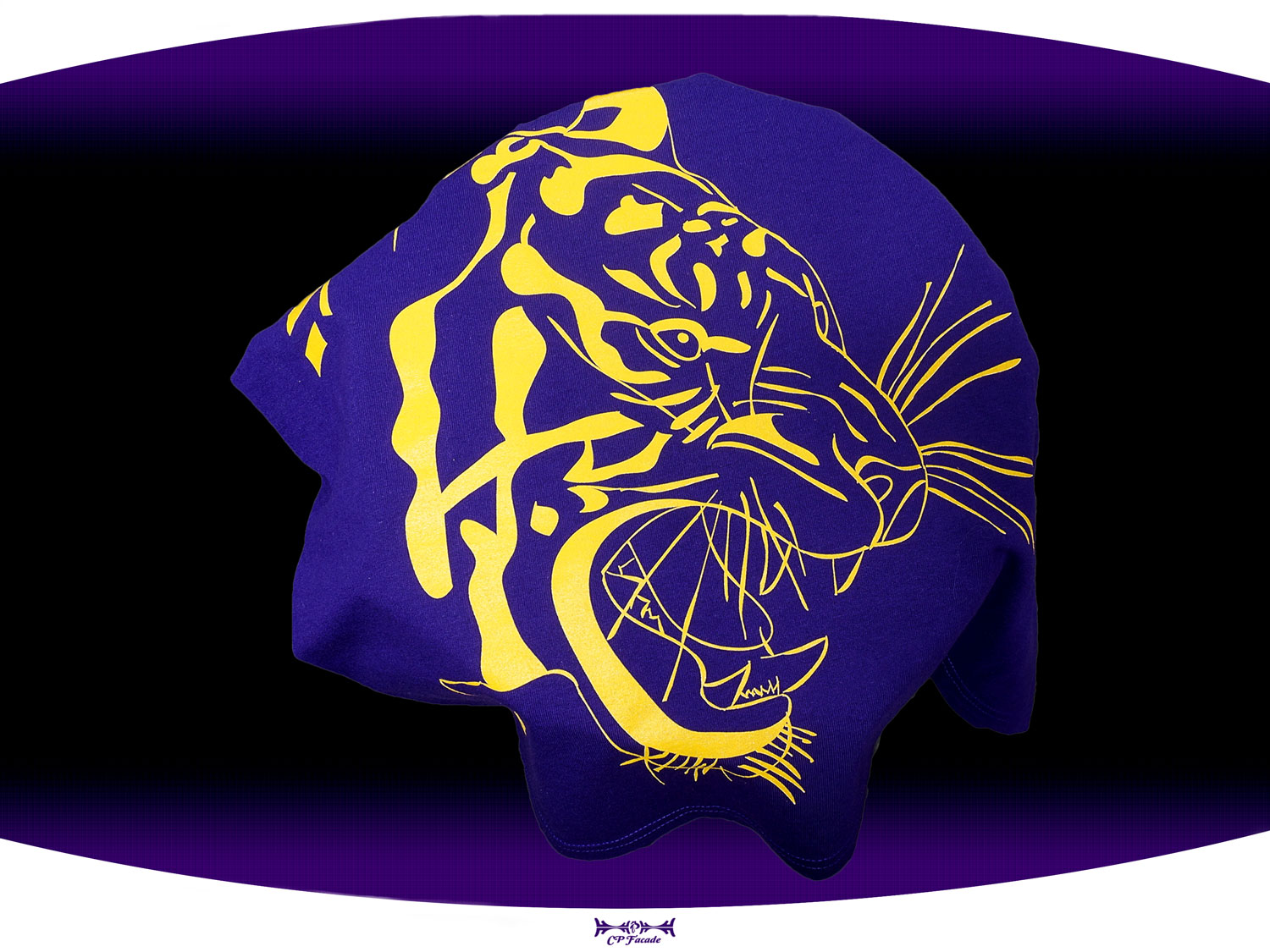 Close up of purple screen printed  LSU t-shirt with a gold outline of a tiger face